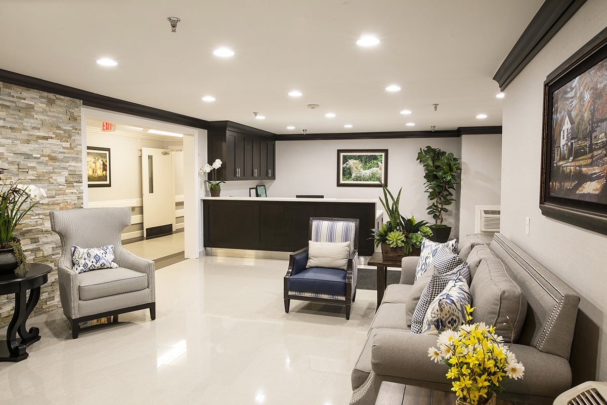 The lobby with chairs and couches at Homestead